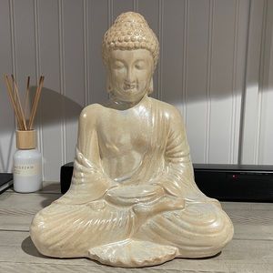 Ceramic buddha statue in a pearl color